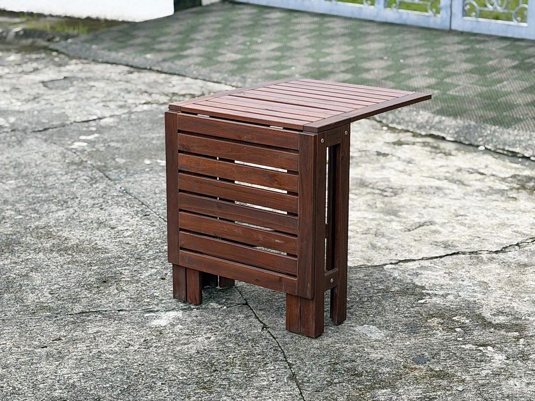 gateleg extendable folding table ~ brown stained Space-Saving Mechanism (Category: Tables & Sets) located in Bulacan. Submitted by rock_off.thriftshop.ph (Listing ID 1460740244, Image 3). Description: ÄPPLARÖ gateleg extendable folding table ~ brown stained Space-Saving Mechanism Features a double drop-leaf, gateleg design allowing it to adjust in size for 2 to 4 people.Material: Built from solid, durable wood with a dark brown stain designed to 
