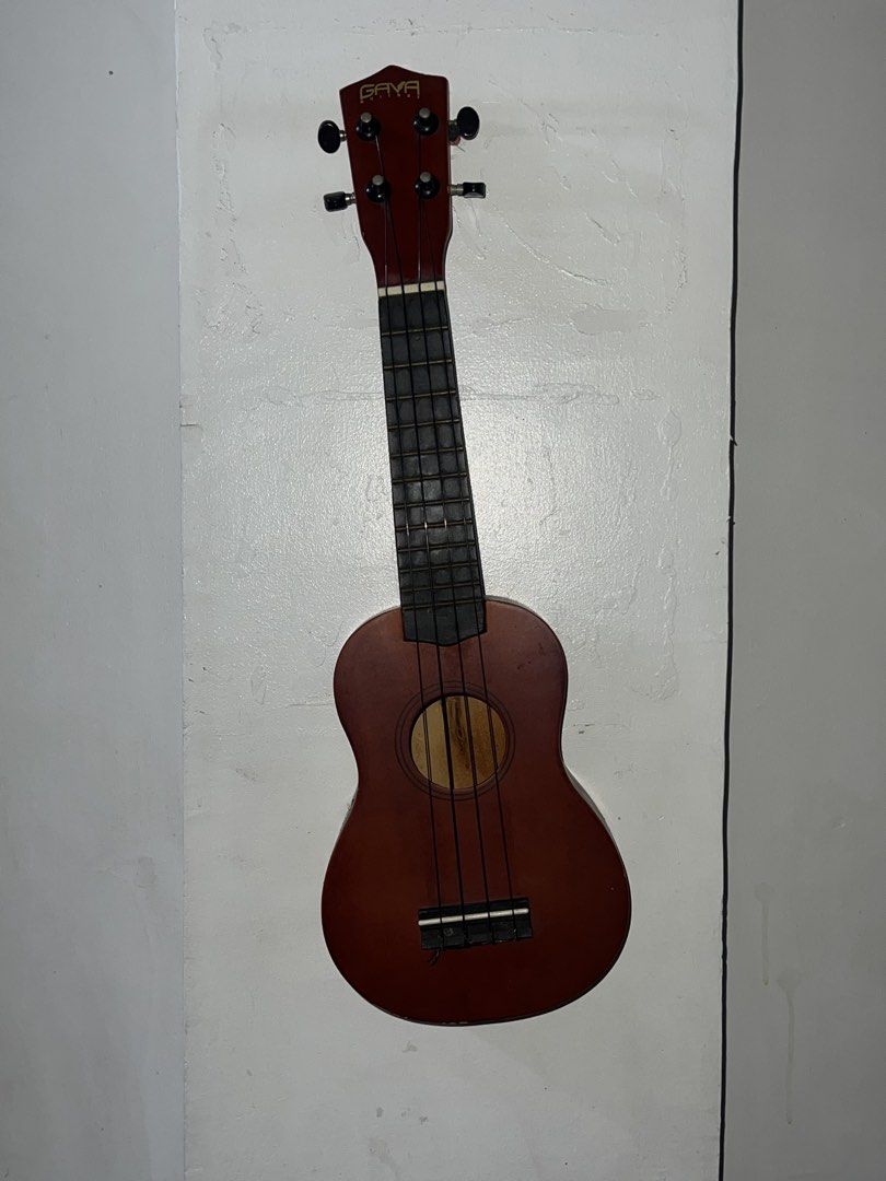 GAVA Ukulele - Brown (Category: Musical Instruments) located in Manila. Submitted by asa68984 (Listing ID 1460878339, Image 1). Description: - Brown GAVA ukulele - 4 strings - Shows cosmetic wear (scratches, scuffs, sticker residue on back) - Fully playable and functional - Ideal for beginners or practice.