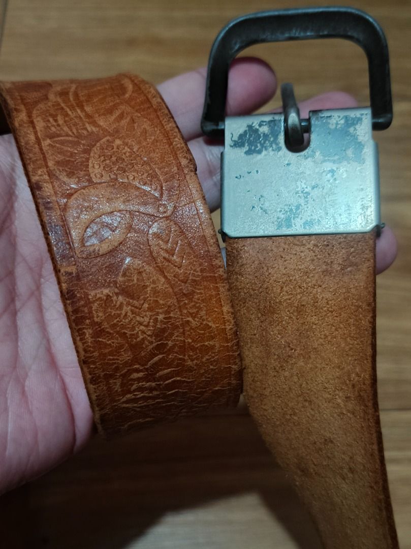 Genuine Belt with Embossed Pattern (Category: Belts) located in Makati City. Submitted by nyxhemera26 (Listing ID 1460800088, Image 3). Description: Genuine Belt with Embossed Pattern - Vintage condition with visible signs of usage - Please note that belt loop is missing - Stylish brown leather belt with an all-over embossed pattern. - Features a metal buckle with slight signs of wear. - Nice tan leather color. - 41.5 inches end to end - Perfect 