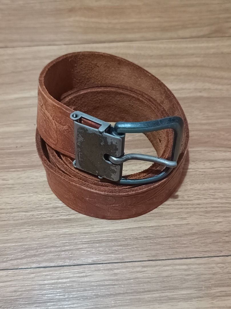 Genuine Belt with Embossed Pattern (Category: Belts) located in Makati City. Submitted by nyxhemera26 (Listing ID 1460800088, Image 1). Description: Genuine Belt with Embossed Pattern - Vintage condition with visible signs of usage - Please note that belt loop is missing - Stylish brown leather belt with an all-over embossed pattern. - Features a metal buckle with slight signs of wear. - Nice tan leather color. - 41.5 inches end to end - Perfect 