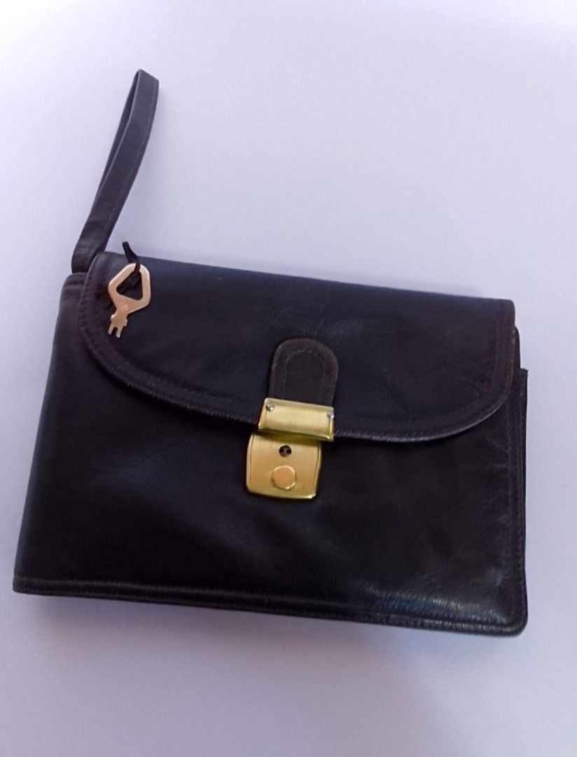 Genuine leather clutch with lock (Category: Belt bags, Clutches and Pouches) located in Binan City. Submitted by chinitasjapanbags (Listing ID 1460825184, Image 1). Description: super nice ng leather ..daming compartments ..kasya cp and long wallet .with lock and key.