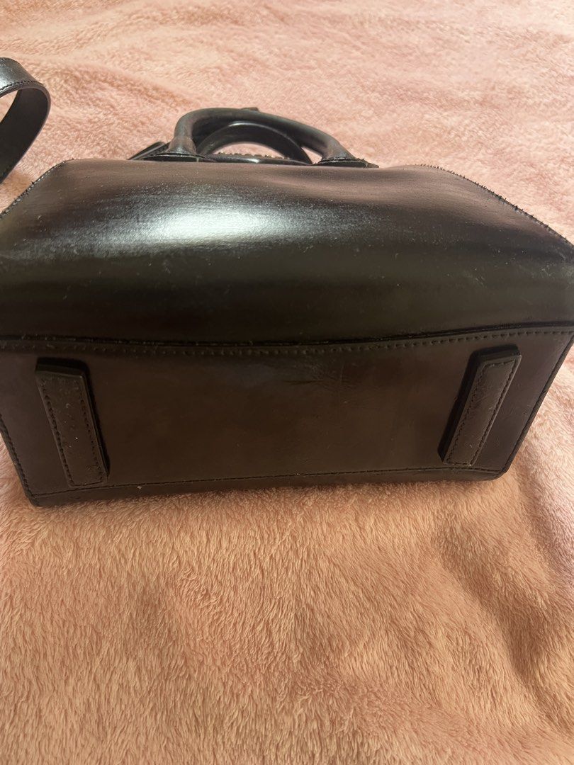 Givenchy Black Leather Antigona Mini Bag (Category: Luxury Bags & Wallets) located in Davao. Submitted by omygg (Listing ID 1460772400, Image 3). Description: - Authentic Givenchy Antigona Bag - Mini Size - Color: Black - Material: Leather - Features: Top handles, detachable shoulder strap - Hardware: Silver - Style: Classic structured shape, perfect for everyday or evening use - Interior: Spacious for essentials -new model removable strap.