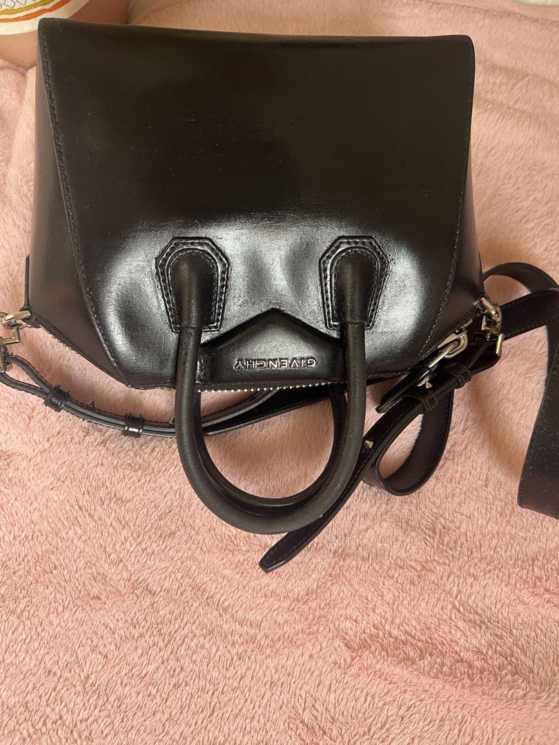 Givenchy Black Leather Antigona Mini Bag (Category: Luxury Bags & Wallets) located in Davao. Submitted by omygg (Listing ID 1460772400, Image 2). Description: - Authentic Givenchy Antigona Bag - Mini Size - Color: Black - Material: Leather - Features: Top handles, detachable shoulder strap - Hardware: Silver - Style: Classic structured shape, perfect for everyday or evening use - Interior: Spacious for essentials -new model removable strap.