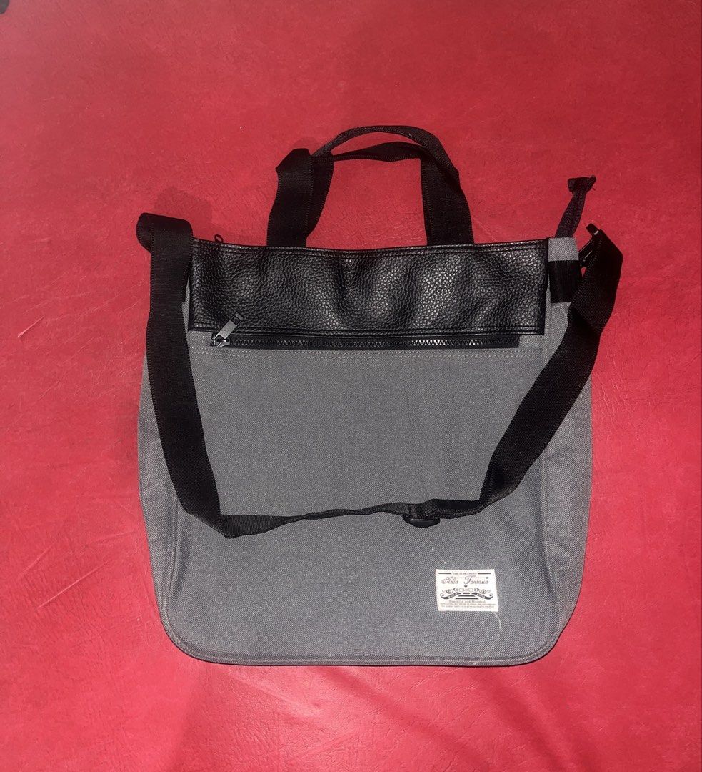 Gray Crossbody Bag (Category: Cross-body Bags) located in Davao. Submitted by janna_soleil (Listing ID 1460876010, Image 1). Description: gray canvas and faux-leather convertible tote and crossbody bag with top handles and an adjustable black strap.
