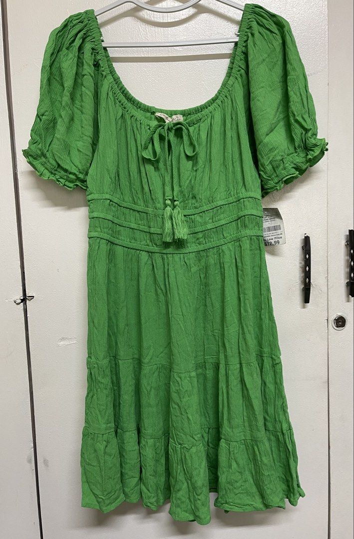 Green Boho Style Dress (Category: Dresses) located in San Juan City. Submitted by marthina.jacobo (Listing ID 1460909243, Image 2). Description: Short-sleeved tiered mini dress featuring a tie-front tassel detail and smocked bodice accents RFS: Decluttering Actual color may slightly vary due to lighting ₱350 + sf Modes of payment are through Unionbank/Metrobank/ GoTyme/ GCash.