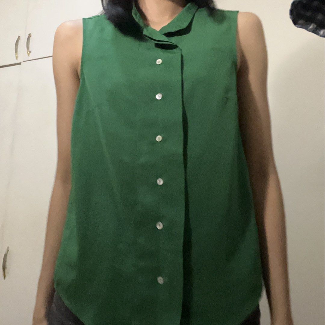 Green Sleeveless Button-Up Top (Category: Sleeveless) located in Marikina City. Submitted by preloved.mana (Listing ID 1460776616, Image 2). Description: - H&M at wash tag, with spare button - size small to semi med MOP: gcash, maya MOD: jnt, lalamove LOC: marikina.