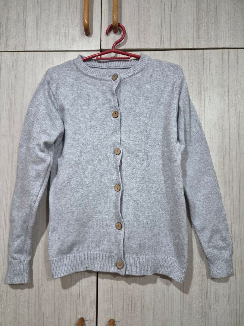 Grey Button Up Cardigan (Category: Coats, Jackets and Outerwear) located in Manila. Submitted by fayiefar (Listing ID 1460847894, Image 2). Description: - Simple grey cardigan - Wooden working button details - Crew neck, long sleeves - Ribbed cuffs and hem - Comfortable layering piece - Versatile for casual or dressed-up looks bust- up to 38 inc length- 22 inc - makapal tela.
