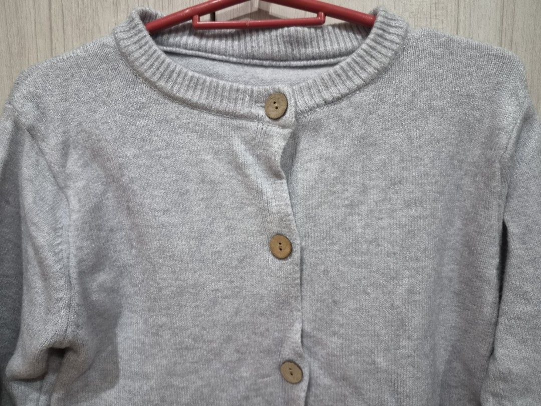 Grey Button Up Cardigan (Category: Coats, Jackets and Outerwear) located in Manila. Submitted by fayiefar (Listing ID 1460847894, Image 3). Description: - Simple grey cardigan - Wooden working button details - Crew neck, long sleeves - Ribbed cuffs and hem - Comfortable layering piece - Versatile for casual or dressed-up looks bust- up to 38 inc length- 22 inc - makapal tela.
