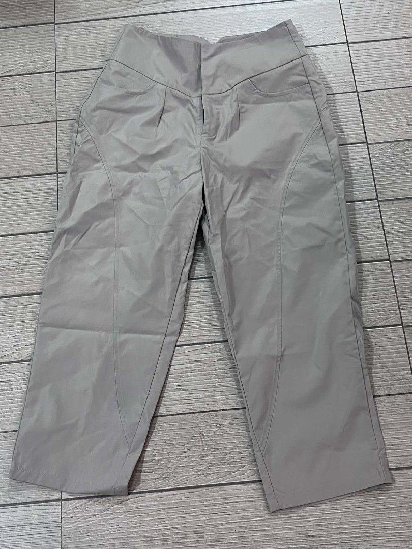 Grey High-Waisted Cropped Trousers (Category: Other Bottoms) located in San Jose del Monte. Submitted by Skin_Care2022 (Listing ID 1460815533, Image 2). Description: - High-waisted grey trousers - Cropped length - Unique seam detail down the legs - Functional pockets - Lightweight fabric, ideal for warmer weather - Relaxed yet structured fit - Versatile for dressing up or down.