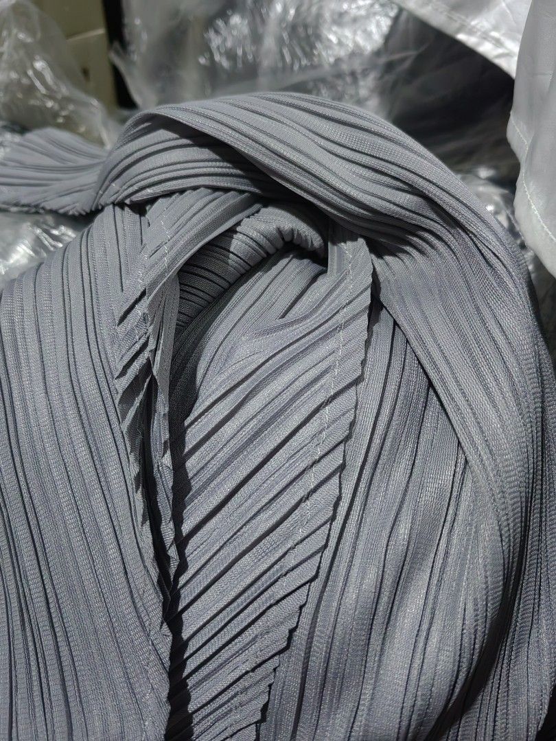 Grey Pleated Wrap Top with Tie Belt (Category: Sleeveless) located in Donsol. Submitted by saksthriftavenuebyluckymaria8 (Listing ID 1460840439, Image 3). Description: - Sleeveless grey top - Flattering V-neckline - Chic wrap-around design - Includes matching waist tie belt - Unique pleat fabric detail - Versatile: pairs well with trousers or Skirts length 22in assymetrical.