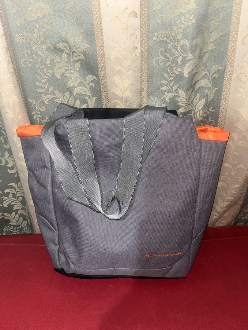 Grey Tote Bag (Category: Tote Bags) located in Davao. Submitted by janna_soleil (Listing ID 1460871615, Image 1). Description: Andre Valentino gray tote bag featuring striking orange accent trim and gray webbing handles.