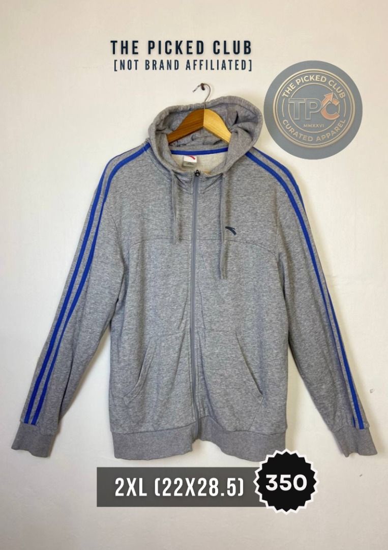 Grey Zip-Up Hoodie with Blue Stripes - Size 2XL (Category: Coats, Jackets and Outerwear) located in Imus. Submitted by thepickedclub (Listing ID 1460827607, Image 1). Description: 2xl (22x28.5) - Grey zip-up hoodie - Blue stripes on sleeves - Features a hood and pockets - Size: 2XL - Measurements: 22" pit to pit, 28.5" length - Ideal for casual wear.