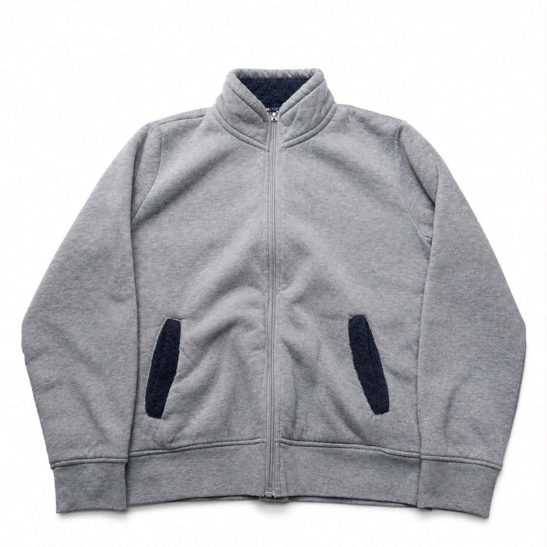 Grey Zip-Up Jacket with Navy Trim (Category: Coats, Jackets and Outerwear) located in Manila. Submitted by chieezz (Listing ID 1460862627, Image 1). Description: - Grey zip-up jacket - Stand-up collar with navy trim - Two front pockets with navy fuzzy lining - Comfortable and casual design - Ideal for layering.
