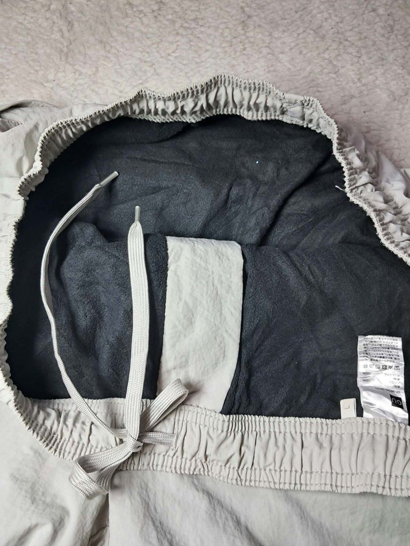 GU Warm Nylon Outdoor Pants Large Grey (Category: Joggers) located in Baguio. Submitted by padisellsz (Listing ID 1460820813, Image 2). Description: - GU Warm Nylon Track Pants - Very good condition - Size: Large - Fits Waist: 32-36 inches - Inseam: 27 inches - Rise: 15 inches - Thigh: 12.5 inches - Features: Zippered pocket, elastic waistband with drawstring, cuffed ankles with drawstring - Material: Lined with fleece for ultimate warmth - May l