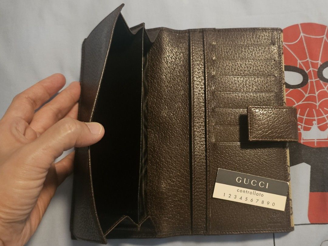 Gucci GG Canvas Long Flap Wallet (Category: Luxury Bags & Wallets) located in Manila. Submitted by fanta0923 (Listing ID 1460722853, Image 2). Description: Authentic — Controllato card included Size: Long / bi-fold — fits all currencies & cards Condition: Used with care. Visible gentle wear on leather tab & trim — no major damage, no lining issues, fully functional. Inclusions: Wallet + Controllato card.