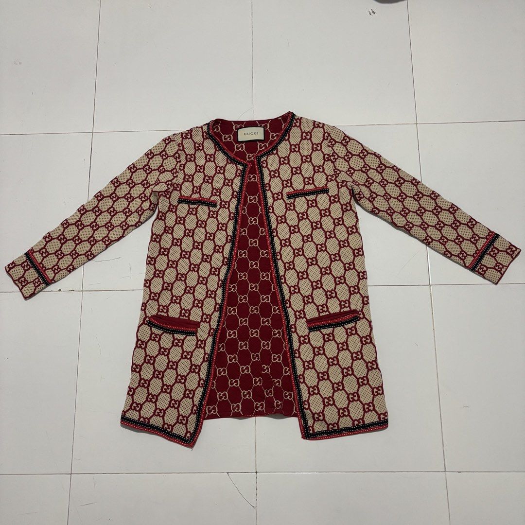 Gucci GG Monogram Knit Cardigan (Category: Luxury Apparel) located in Banga. Submitted by akosiloco (Listing ID 1460723732, Image 1). Description: - Iconic Gucci GG monogram pattern all over - Classic burgundy and beige colorway - Trimmed with red, black, and white ribbon detail - Two functional front pockets - A must-have for any Gucci lover Width 20 Length 29 Excellent Condition 9.8/10 .