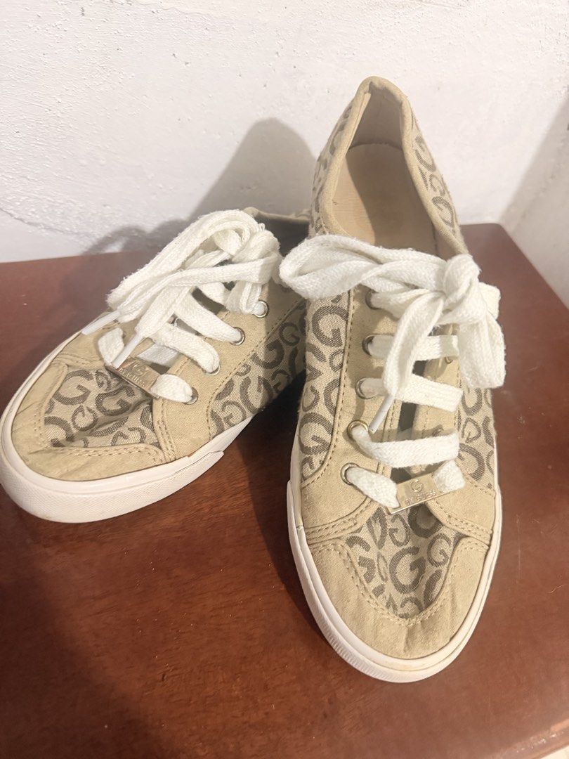 Guess Monogram Canvas Low Top Sneakers (Category: Sneakers) located in Manila. Submitted by sedpuprincess (Listing ID 1460865107, Image 1). Description: - Tan and brown Guess sneakers - All-over monogram print - White laces and soles - Gold 'G' logo with rhinestones on the side - Classic low-top style - Ideal for casual wear.