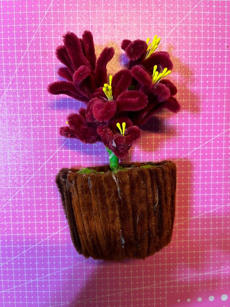 Handmade Pipe Cleaner Flower Pots with Flowers (Category: Pots & Planters) located in Manila. Submitted by zeal.mari62 (Listing ID 1460914673, Image 1). Description: - Handmade flower pots crafted from colorful pipe cleaners. - Each pot features a unique flower color. - Ideal for desk decoration or as a charming small gift. - Adds a unique and colorful touch to any space. - Available as a set or individually..