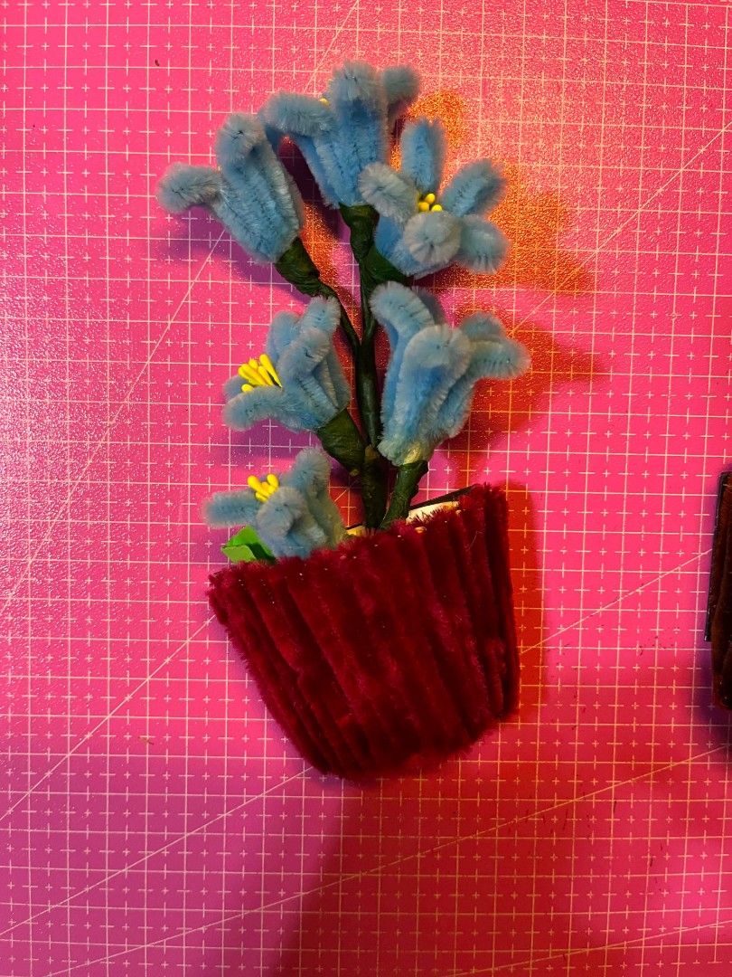 Handmade Pipe Cleaner Flower Pots with Flowers (Category: Pots & Planters) located in Manila. Submitted by zeal.mari62 (Listing ID 1460914673, Image 3). Description: - Handmade flower pots crafted from colorful pipe cleaners. - Each pot features a unique flower color. - Ideal for desk decoration or as a charming small gift. - Adds a unique and colorful touch to any space. - Available as a set or individually..