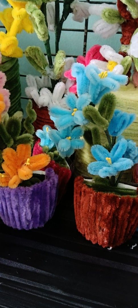 Handmade Pipe Cleaner Flowers in Pots (Category: Artificial Plants & Flowers) located in Manila. Submitted by zeal.mari62 (Listing ID 1460914711, Image 2). Description: - Adorable handmade flowers crafted from pipe cleaners. - Each flower comes in a charming small decorative pot. - Available colors: Blue, Orange, Pink, and Yellow. - Ideal for adding a pop of color to any space. - Makes a unique and thoughtful small gift. - One-of-a-kind, handcraf