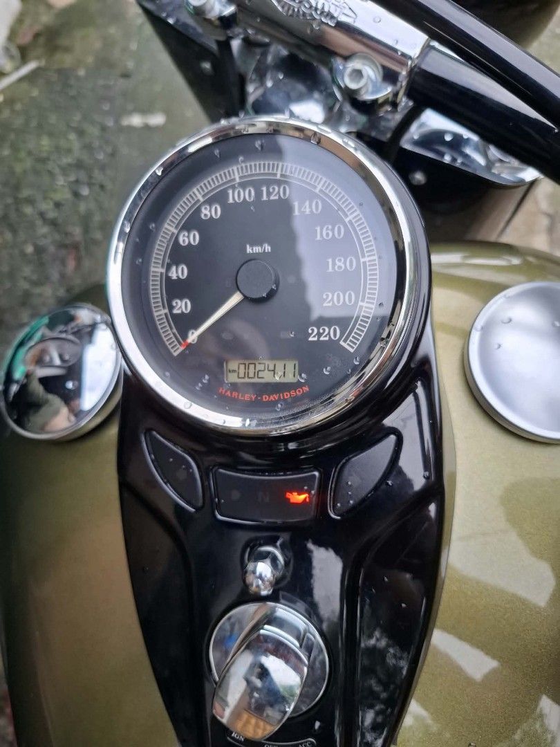 Harley-Davidson 103ci Motorcycle (Category: Motorbikes for Sale) located in Caloocan City. Submitted by mallowie1197492 (Listing ID 1460812580, Image 1). Description: Harley-Davidson motorcycle with a 103ci engine. Olive green tank and black accents. Chrome exhaust pipes. Low mileage shown on the odometer. Ready for the road. odo 2384.