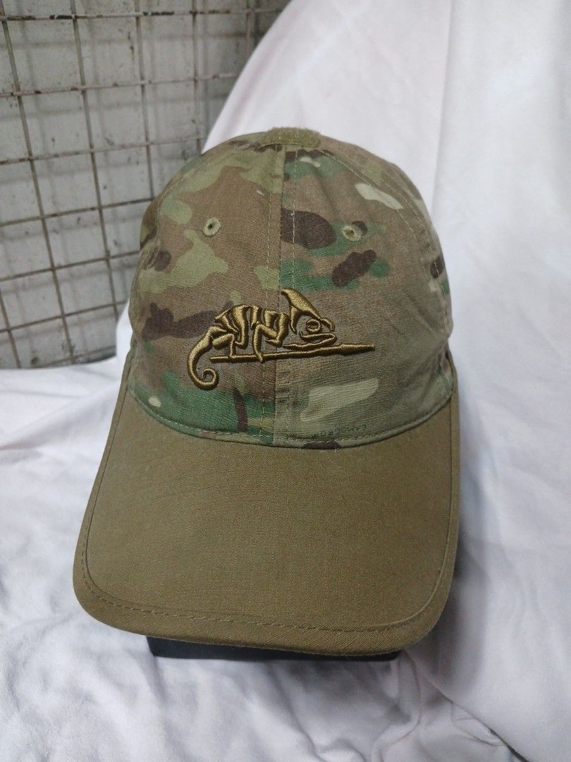 Helikon-Tex Cap (Category: Caps & Hats) located in La Trinidad. Submitted by dashopperist (Listing ID 1460764009, Image 1). Description: - Helikon-Tex Logo Cap - Authentic Multicam pattern - Features unique chameleon embroidery on the front - Adjustable strap at the back for a customized fit - Versatile for outdoor adventures or everyday casual style - One size fits most.