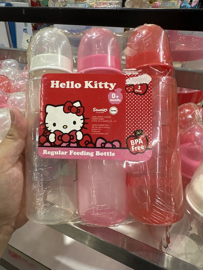 Hello Kitty Regular Feeding Bottles 3-Pack (Category: Breastfeeding & Bottle Feeding) located in Manila. Submitted by michaellal91842 (Listing ID 1460838748, Image 2). Description: - Set of 3 Kitty regular feeding bottles - Colors: Red, Pink, and Clear - Features cute apple and Kitty designs - Suitable for babies 0+ months - BPA-free for your baby's safety - Perfect for your little one's feeding needs.