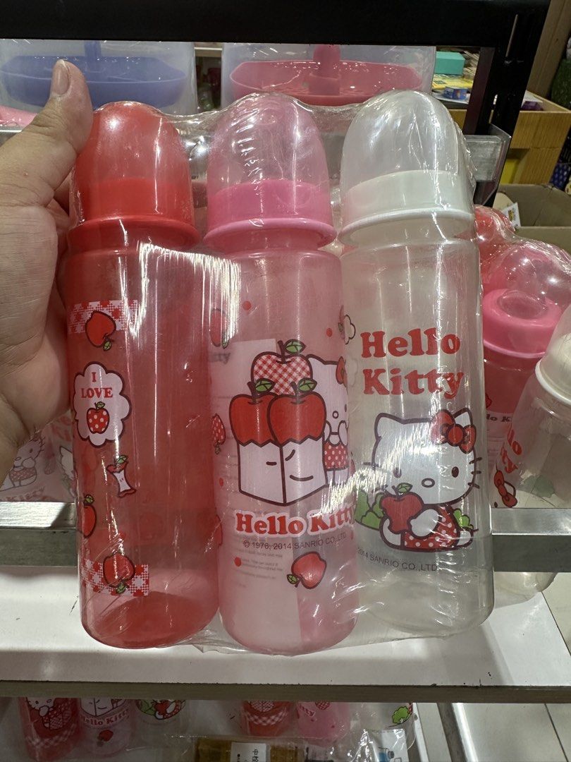 Hello Kitty Regular Feeding Bottles 3-Pack (Category: Breastfeeding & Bottle Feeding) located in Manila. Submitted by michaellal91842 (Listing ID 1460838748, Image 1). Description: - Set of 3 Kitty regular feeding bottles - Colors: Red, Pink, and Clear - Features cute apple and Kitty designs - Suitable for babies 0+ months - BPA-free for your baby's safety - Perfect for your little one's feeding needs.