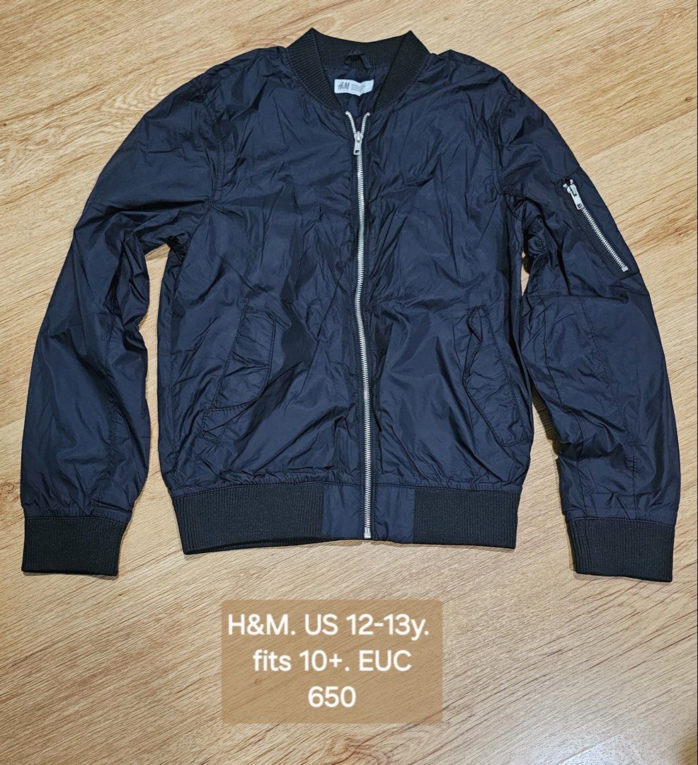 H&M Bomber Jacket US 12-13y (Category: Babies & Kids Fashion) located in Manila. Submitted by little_dees_shop (Listing ID 1460727297, Image 1). Description: - Black H&M bomber jacket - Fits 10 years and up - Zip closure - Front pockets - Zip pocket on the sleeve - Ribbed cuffs and hem - Great for everyday wear.