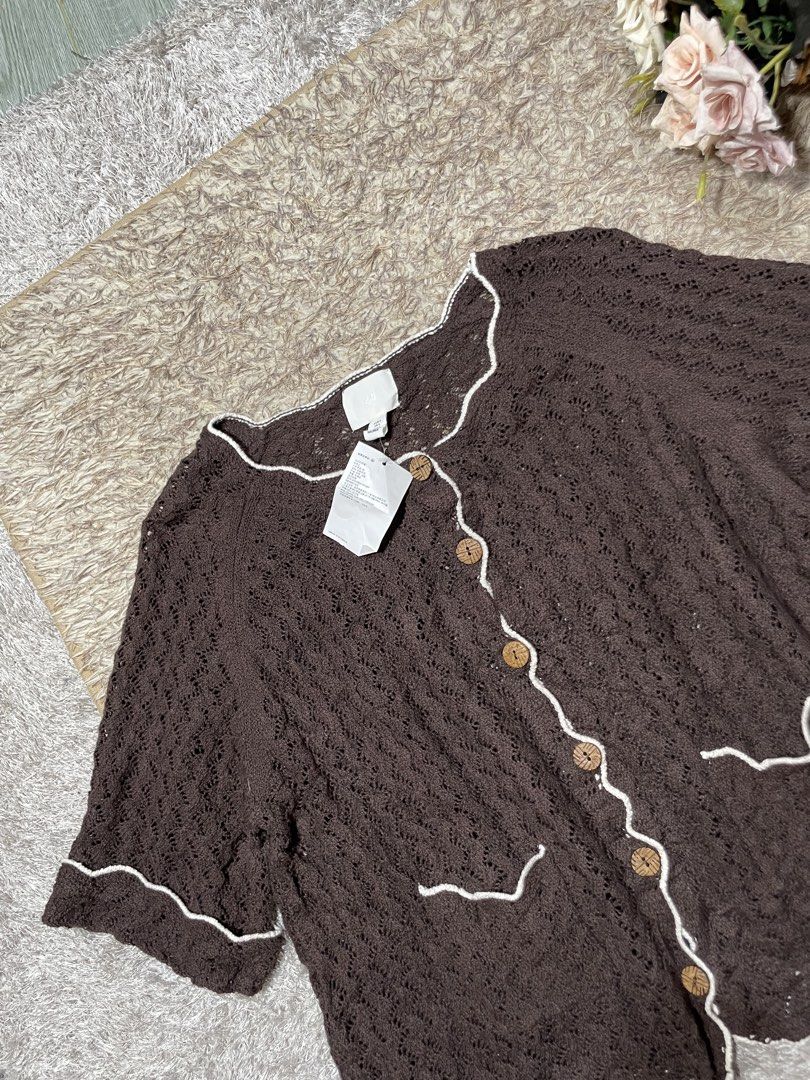 H&M Brown Crochet Button-Up Cardigan (Category: Coats, Jackets and Outerwear) located in Manila. Submitted by rutchemari68583 (Listing ID 1460775132, Image 3). Description: - Brown crochet cardigan from H&M - Size S - Short sleeves with scalloped trim - Button-up front with wooden buttons - Two front pockets - Ideal for layering over dresses or with jeans.