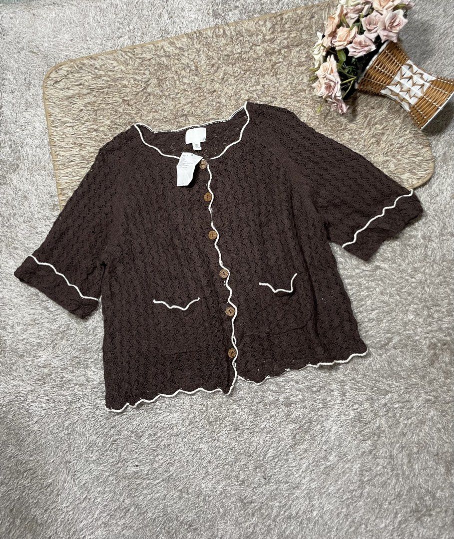 H&M Brown Crochet Button-Up Cardigan (Category: Coats, Jackets and Outerwear) located in Manila. Submitted by rutchemari68583 (Listing ID 1460775132, Image 2). Description: - Brown crochet cardigan from H&M - Size S - Short sleeves with scalloped trim - Button-up front with wooden buttons - Two front pockets - Ideal for layering over dresses or with jeans.
