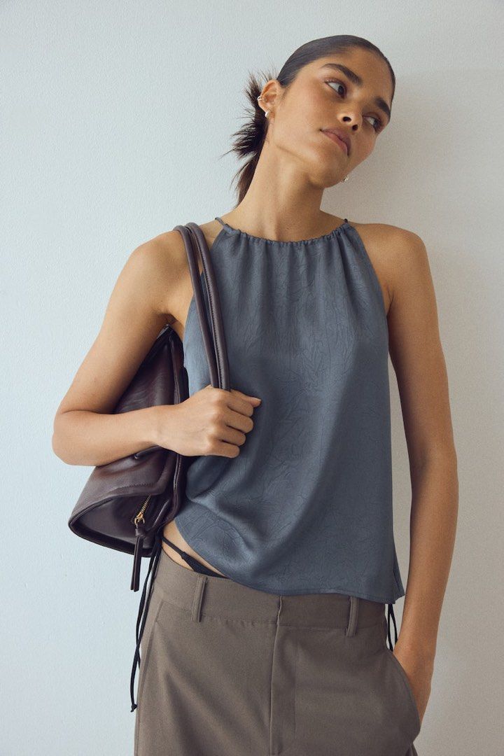 h&m crinkled satin halter top (Category: Sleeveless) located in Caloocan City. Submitted by v6nnies (Listing ID 1460882280, Image 1). Description: h&m crinkled satin top grey halter size xs -s xs on tag fit runs big only worn once kinda low cut on sides (arm hole) last price already! :).