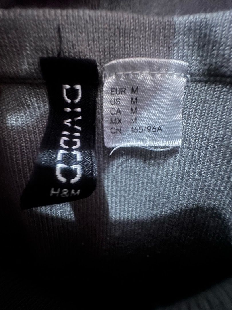 H&M Divided Grey Off-Shoulder Knit Top | Size M (Category: Blouses) located in Manila. Submitted by bbyadi777 (Listing ID 1460763248, Image 2). Description: H&M Divided gray off-shoulder top • Size M • Wide off-shoulder neckline • Fitted silhouette • Soft and stretchy material • Simple but flattering, perfect with jeans, trousers, or skirts Condition: Good preloved condition RFS: Closet decluttering.