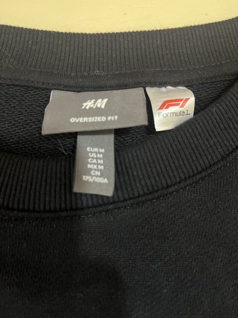 H&M Formula 1 Oversized Fit Black Sweatshirt (Category: Coats, Jackets and Outerwear) located in Manila. Submitted by mikeezs (Listing ID 1460763897, Image 2). Description: - Black H&M Sweatshirt - Features a cool Formula 1 graphic - Oversized fit - Size: Medium - Ideal for casual wear - Comfortable and stylish - Perfect for F1 enthusiasts.