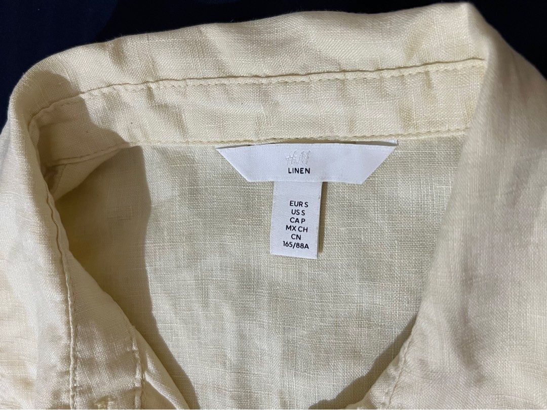 H&M Linen Shirt (Category: Shirts) located in Caloocan City. Submitted by mommycheadde (Listing ID 1460771143, Image 2). Description: - Light yellow H&M linen shirt - Long sleeves with button cuffs - Single chest pocket - Button-up front - Ideal for casual wear or layering.
