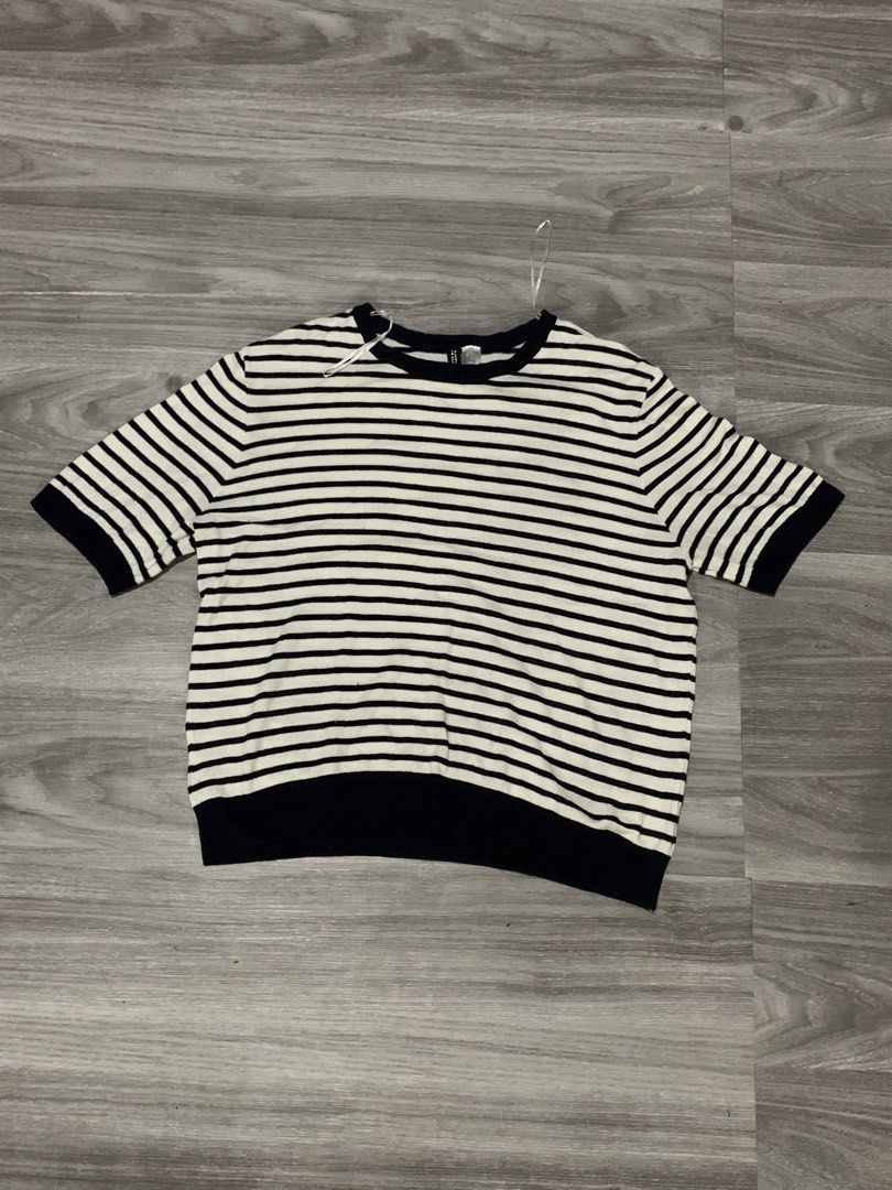 H&M Striped Short Sleeve Top Size M (Category: Blouses) located in Makati City. Submitted by bastiolarteee (Listing ID 1460870258, Image 1). Description: - Classic black and white striped top - Brand: H&M - Short sleeves - Crew neck - Ribbed hem and cuffs - Comfortable knit material - Ideal for casual wear or layering.