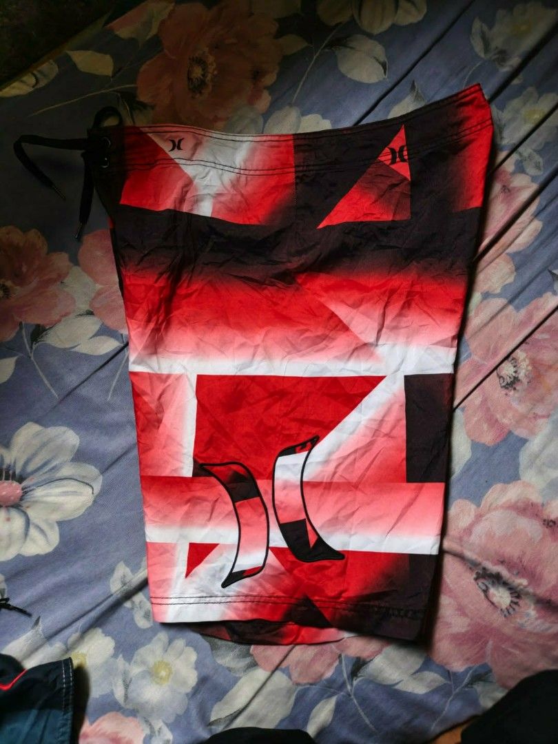 Hurley Board Shorts Red Black White Geometric Pattern (Category: Shorts) located in Bacolod City. Submitted by miggyguarte (Listing ID 1460723447, Image 1). Description: Hurley board shorts - Bold red, black, white geometric print. Back velcro pocket, drawstring waist. Perfect for swimming or lounging..