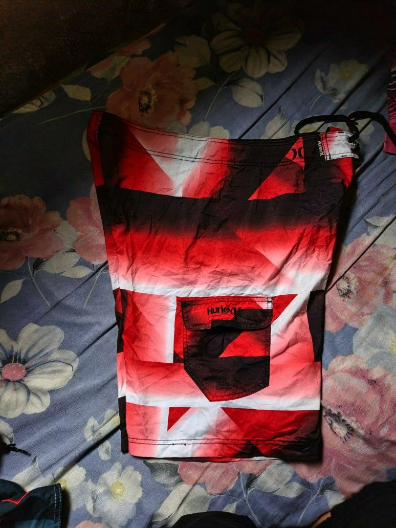 Hurley Board Shorts Red Black White Geometric Pattern (Category: Shorts) located in Bacolod City. Submitted by miggyguarte (Listing ID 1460723447, Image 2). Description: Hurley board shorts - Bold red, black, white geometric print. Back velcro pocket, drawstring waist. Perfect for swimming or lounging..