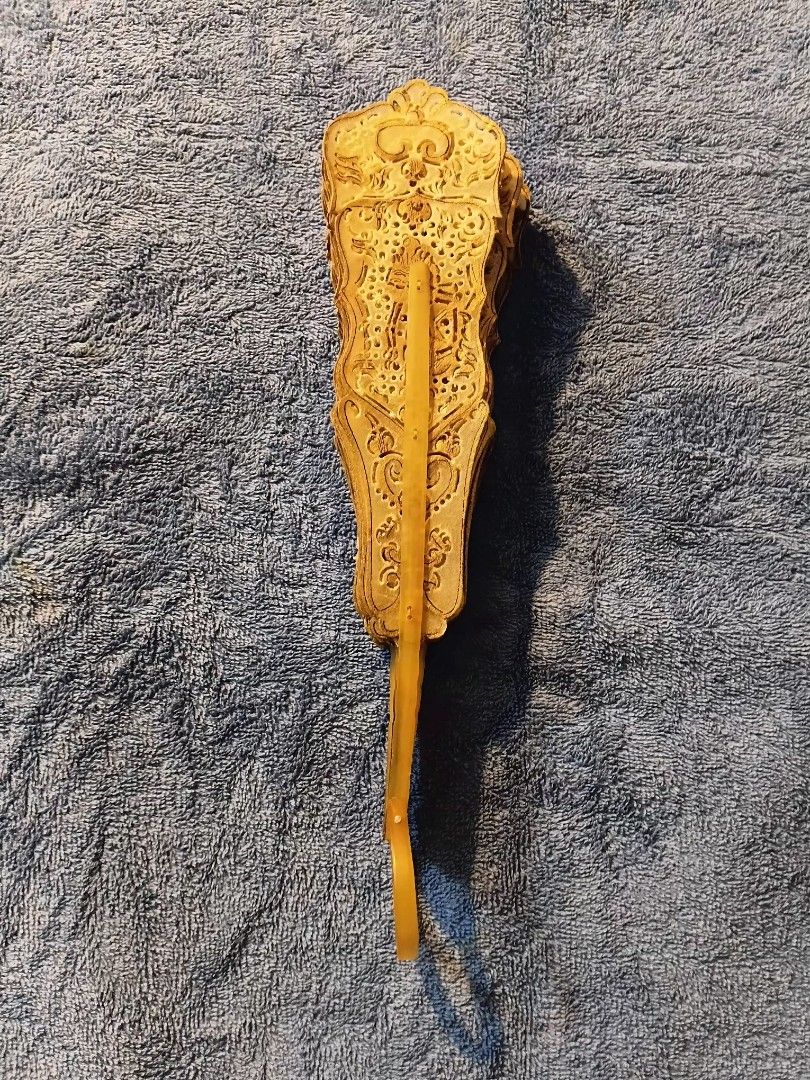 Indonesian Wayang folding hand fan (Category: Fans) located in Manila. Submitted by gt747express (Listing ID 1460891515, Image 3). Description: This object is an antique Javanese Wayang folding fan from Indonesia. It is an openwork, brisé-style fan handcrafted from gilded and pierced animal vellum (parchment), typically made from water buffalo hide. size : 12 x 19 inches spread.