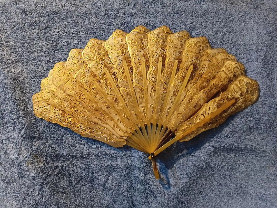 Indonesian Wayang folding hand fan (Category: Fans) located in Manila. Submitted by gt747express (Listing ID 1460891515, Image 2). Description: This object is an antique Javanese Wayang folding fan from Indonesia. It is an openwork, brisé-style fan handcrafted from gilded and pierced animal vellum (parchment), typically made from water buffalo hide. size : 12 x 19 inches spread.