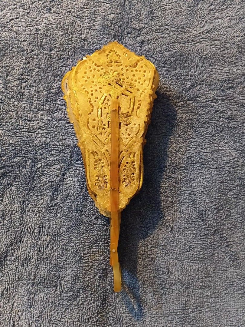 Indonesian Wayang folding hand fan (Category: Fans) located in Manila. Submitted by gt747express (Listing ID 1460893480, Image 3). Description: This object is an antique Javanese Wayang folding fan from Indonesia. It is an openwork, brisé-style fan handcrafted from gilded and pierced animal vellum (parchment), typically made from water buffalo hide. size : 9 x 14 inches spread.