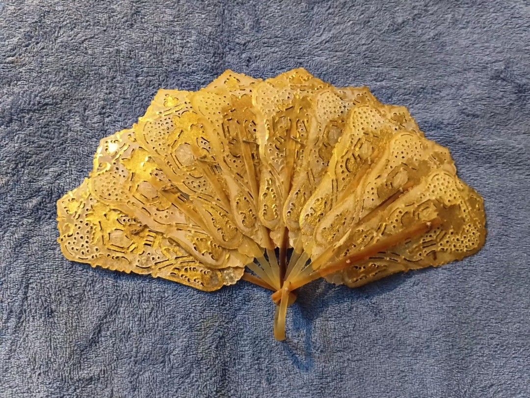 Indonesian Wayang folding hand fan (Category: Fans) located in Manila. Submitted by gt747express (Listing ID 1460893480, Image 2). Description: This object is an antique Javanese Wayang folding fan from Indonesia. It is an openwork, brisé-style fan handcrafted from gilded and pierced animal vellum (parchment), typically made from water buffalo hide. size : 9 x 14 inches spread.