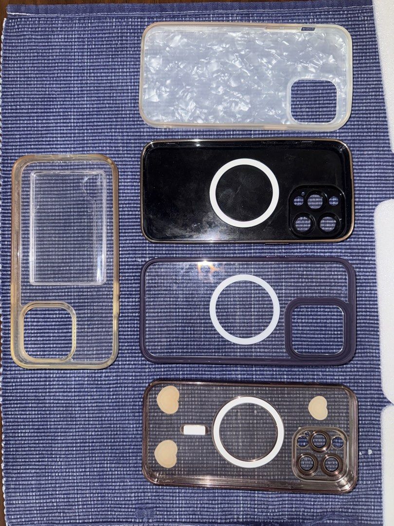 iPhone 14 Pro Max Cases - Magsafe Compatible (Category: Cases & Sleeves) located in Paranaque City. Submitted by goldboxph (Listing ID 1460741851, Image 2). Description: - Bundle of 4 cases for iPhone 13 Pro Max - Clear case with gold frame - Black case with gold Magsafe ring - Clear case with purple frame and Magsafe ring - Beige case with purple hearts and Magsafe ring - Protect your iPhone 13 Pro Max with these stylish options.