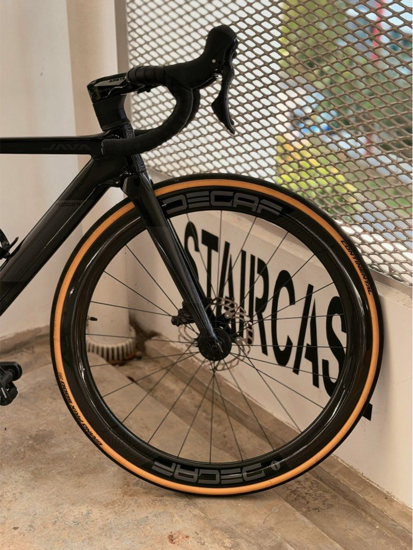 Java fuoco roadbike (Category: Bicycles) located in Singapore. Submitted by sig_ma_male (Listing ID 1460765758, Image 9). Description: Price is negotiable , bike was recently serviced full carbon java fuoco size 48 decaf ariete integrated cockpit ultegra crank shimano 105 shifters shimano 105 groupset kmc sl speed chain(chain snapped,will replace soon with better chain) carbon speedo mount carbon java seatpost fizik bw saddle (extra accessories) 