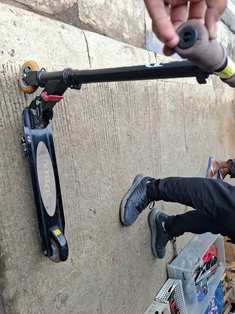 JD Bug Scooter (Category: Skates, Rollerblades & Scooters) located in Manila. Submitted by rocksolid227 (Listing ID 1460764131, Image 3). Description: - Black JD Bug scooter - Folds for easy storage and transport - Grips are a bit worn but still functional - Wheels are in decent condition - Great for getting around.