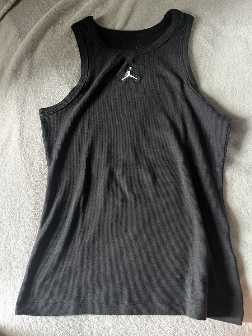 Jordan Black Ribbed Tank Top Size S (Category: Sleeveless) located in Mandaluyong City. Submitted by extremelysexyandcool (Listing ID 1460790588, Image 1). Description: - Brand: Jordan - Color: Black - Style: Ribbed tank top - Features: Iconic Jumpman logo - Fit: Tight/Fitted - Versatile: Ideal for workouts or casual wear.