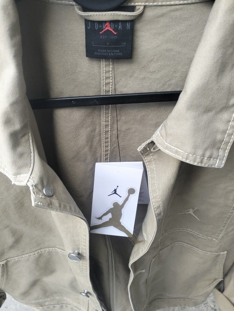 Jordan Utility Jacket Tan Khaki (Category: Coats, Jackets and Outerwear) located in Cavite. Submitted by cocorancho (Listing ID 1460716042, Image 3). Description: - Jordan utility jacket - Tan/khaki color - Button-up front - Two chest pockets - Two large front pockets - Jordan branding on chest - Tag inside with branding - Perfect for casual outfits.