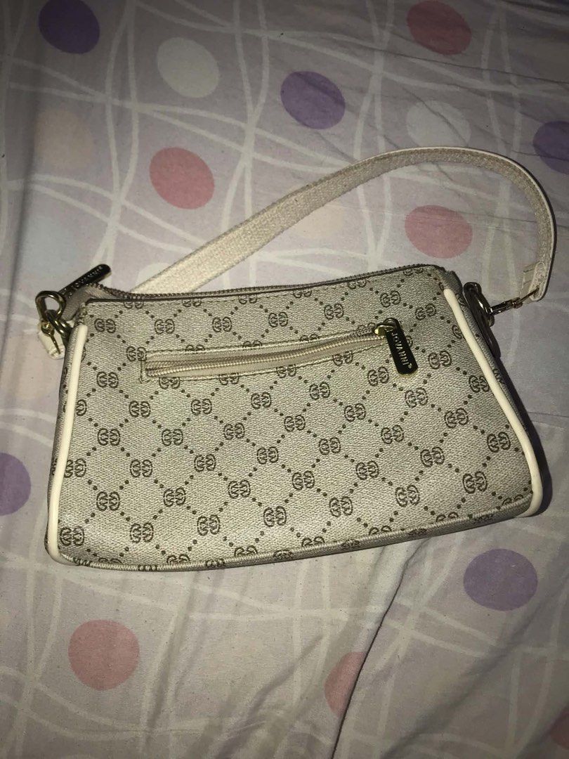 Jovanni Shoulder Bag (Category: Luxury Bags & Wallets) located in Antipolo. Submitted by noellemags (Listing ID 1460900920, Image 2). Description: - Cute shoulder bag with classic monogram pattern - Tan and white colorway - Secure top zipper closure - Convenient small zip pocket on the back - Adjustable strap for comfortable wear - Ideal for everyday use, fits all your essentials.