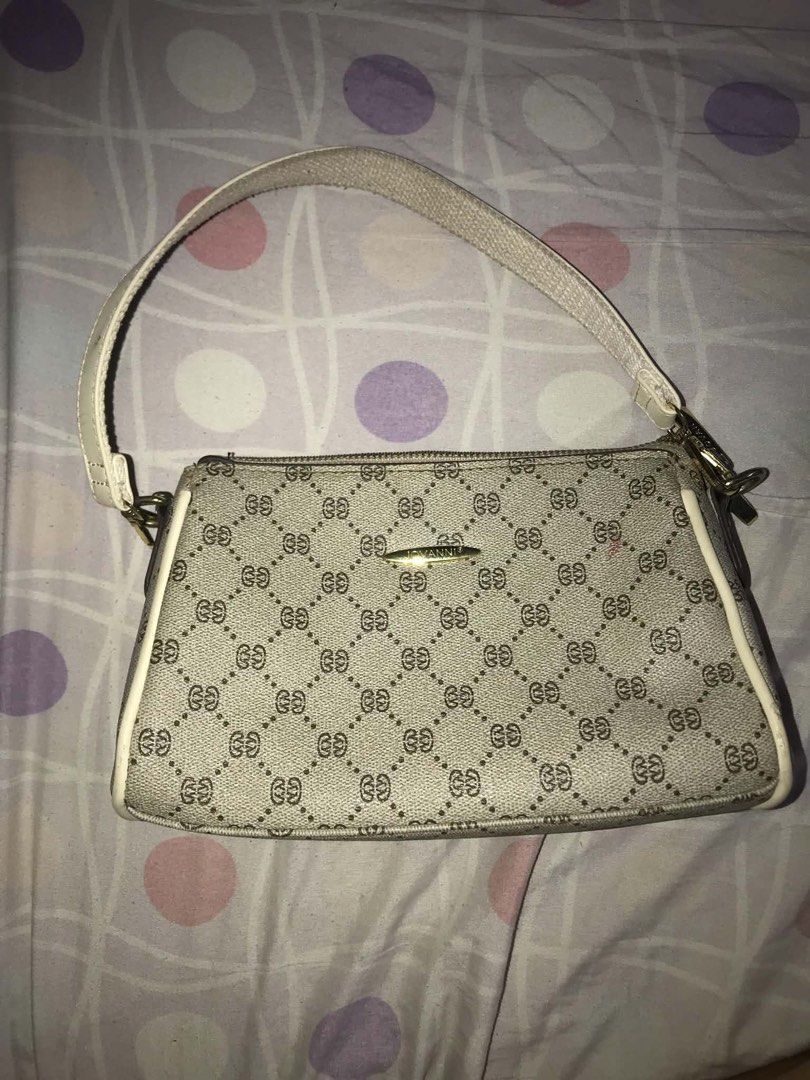 Jovanni Shoulder Bag (Category: Luxury Bags & Wallets) located in Antipolo. Submitted by noellemags (Listing ID 1460900920, Image 1). Description: - Cute shoulder bag with classic monogram pattern - Tan and white colorway - Secure top zipper closure - Convenient small zip pocket on the back - Adjustable strap for comfortable wear - Ideal for everyday use, fits all your essentials.
