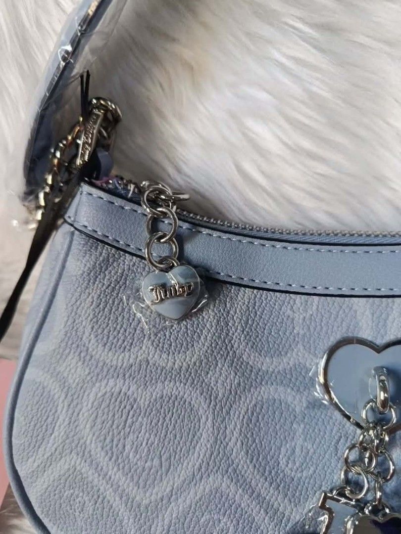 Juicy Couture Bubble Shoulder Bag - Dusty Blue (Category: Shoulder Bags) located in Cavite. Submitted by sweetalittlemonstertoo (Listing ID 1460721930, Image 3). Description: - Authentic Juicy Couture shoulder bag - Features iconic all-over heart logo pattern - Adorable heart and JC charms included - Pretty pink interior lining - Ideal size for carrying your essentials - Brand new with original tags still attached.